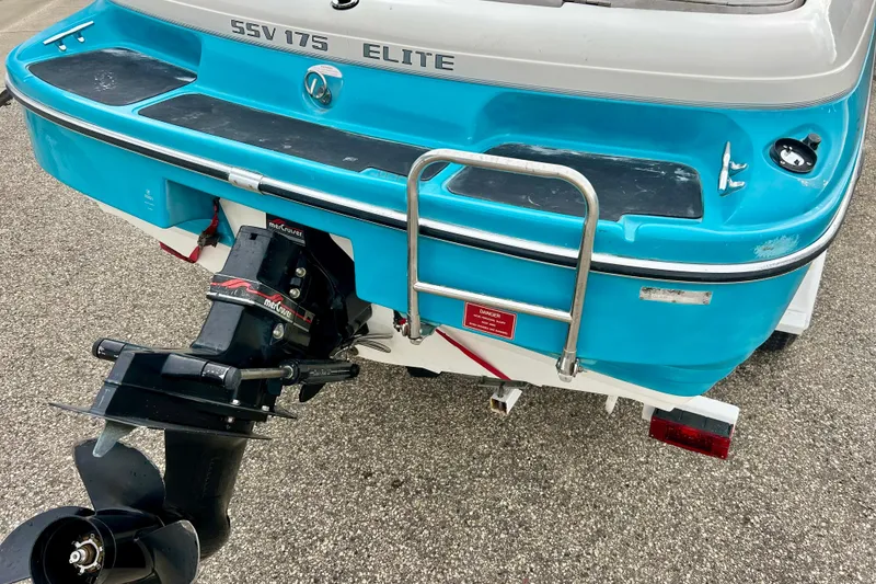 Slide: The Image of 1993 Glastron SSV 175 boat rear view with outboard motor and ladder. - 5