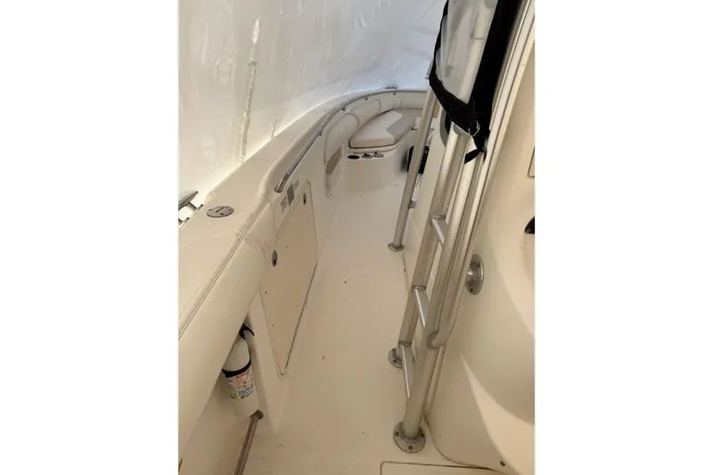 Slide: The Image of 2004 Boston Whaler 320 Outrage interior with seating and safety equipment. - 11