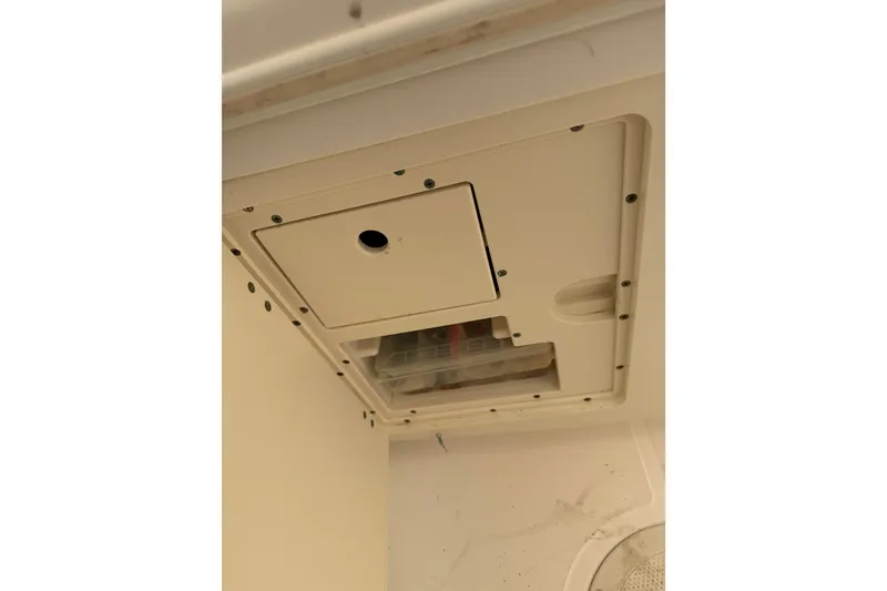 Slide: The Image of 2004 Boston Whaler 320 Outrage electrical panel with access hatch and wiring. - 15