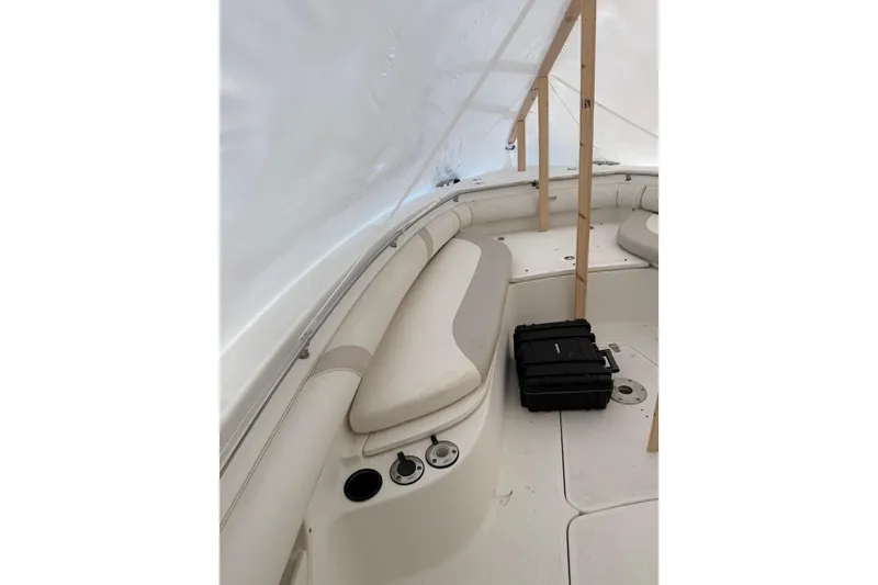 Slide: The Image of 2004 Boston Whaler 320 Outrage interior with seating and storage case. - 5