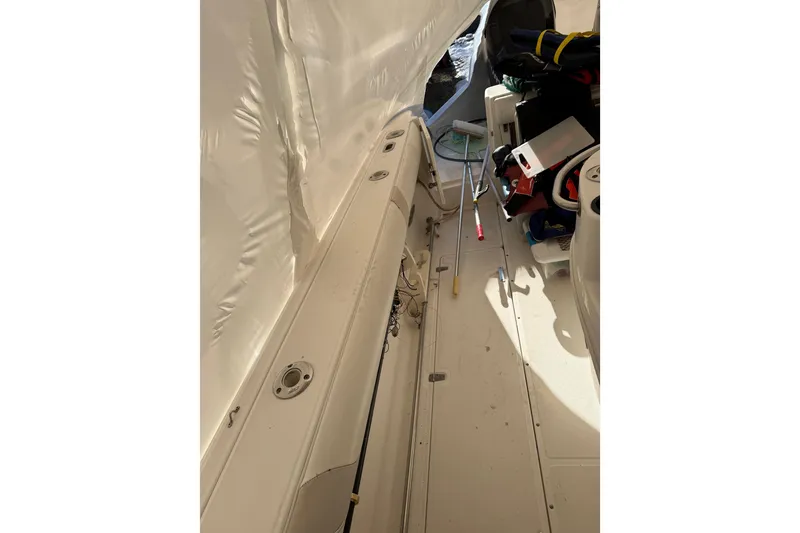 Slide: The Image of 2004 Boston Whaler 320 Outrage interior with fishing gear and equipment. - 7