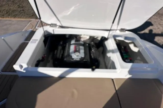 Slide: The Image of 2024 Sea Ray SPX 210 boat engine compartment with open hatch. - 20