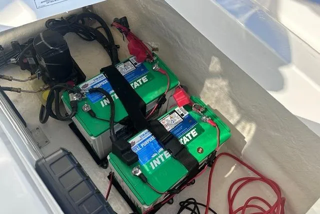Slide: The Image of Two Interstate batteries in a 2024 Sea Ray SPX 210 boat compartment. - 22