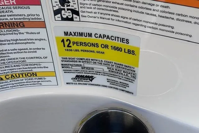 Slide: The Image of 2024 Sea Ray SPX 210 capacity label: 12 persons or 1660 lbs, safety compliance details. - 25