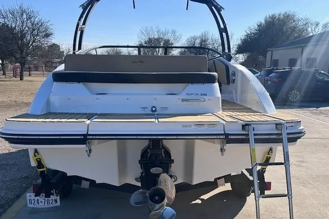 Slide: The Image of 2024 Sea Ray SPX 210 boat, rear view with swim platform and ladder. - 4