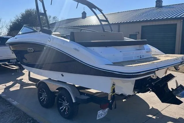 Slide: The Image of 2024 Sea Ray SPX 210 boat on trailer, parked outdoors, rear view. - 5