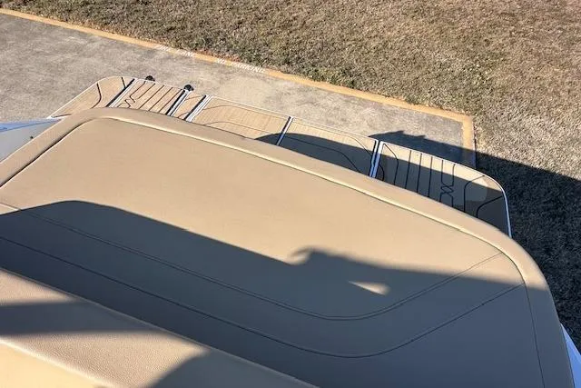 Slide: The Image of 2024 Sea Ray SPX 210 boat with tan upholstery and swim platform. - 8