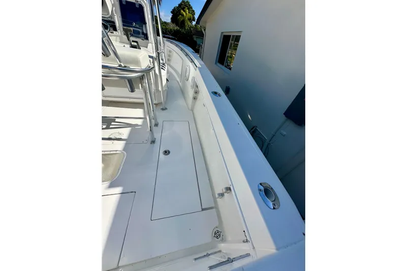 Slide: The Image of 2001 Contender 23 Open boat covered, parked on trailer with Yamaha V225 outboard motor. - 12