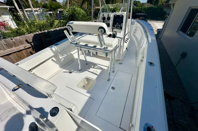 Slide: The Image of 2001 Contender 23 Open boat interior with white seating and clean deck. - 17
