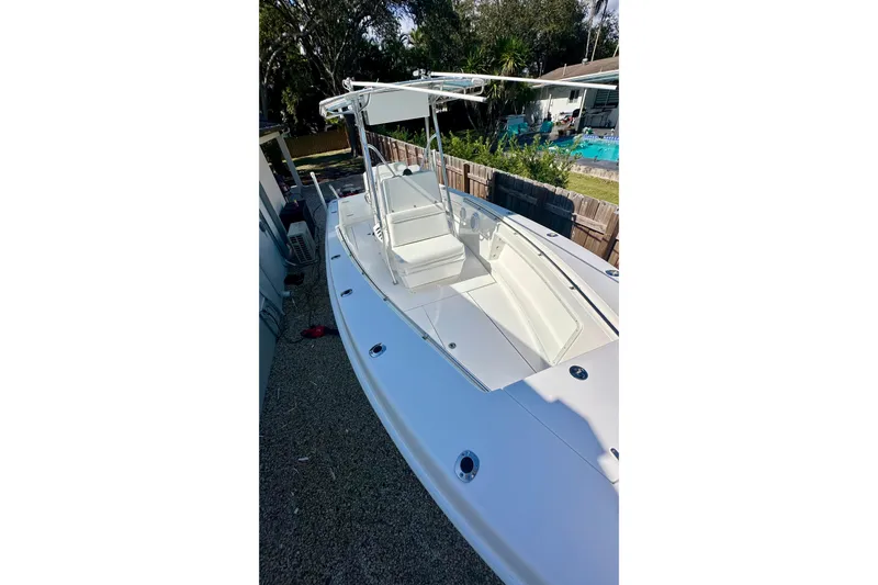 Slide: The Image of 2001 Contender 23 Open boat console with steering wheel and instrument panel. - 32