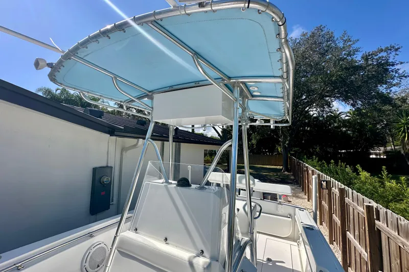 Slide: The Image of 2001 Contender 23 Open boat interior with seating and control panel. - 37