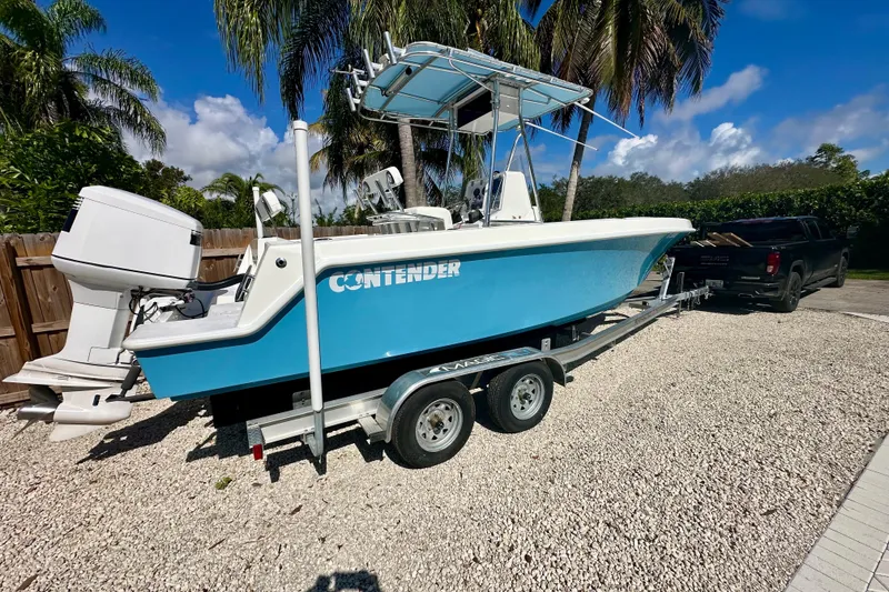 Slide: The Image of 2001 Contender 23 Open boat with Yamaha V6 outboard motor on trailer. - 4