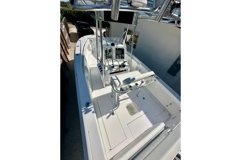 Slide: The Image of Electrical wiring and batteries inside a 2001 Contender 23 Open boat. - 49