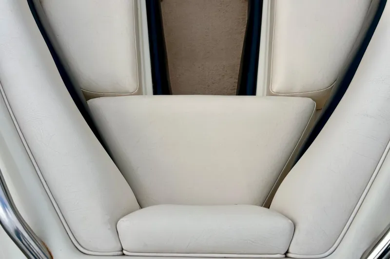 Slide: The Image of White leather seating in a 1995 Crownline 202 BR boat interior. - 11