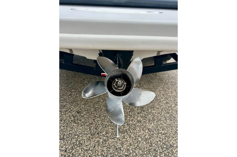 Slide: The Image of Propeller of 1995 Crownline 202 BR boat on a trailer. - 15