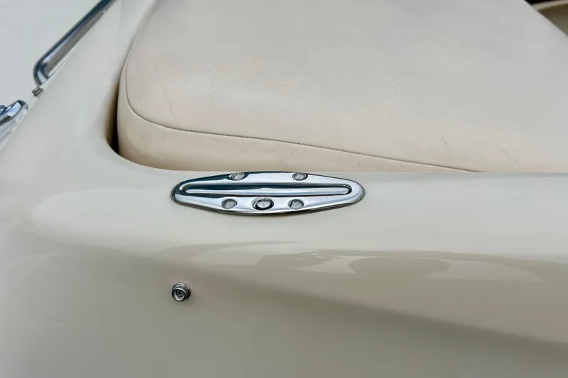 Slide: The Image of 1995 Crownline 202 BR boat detail with beige upholstery and chrome hardware. - 18