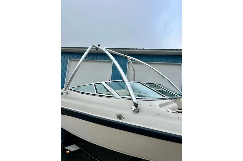 Slide: The Image of 1995 Crownline 202 BR boat with a sleek design and aluminum wakeboard tower. - 20