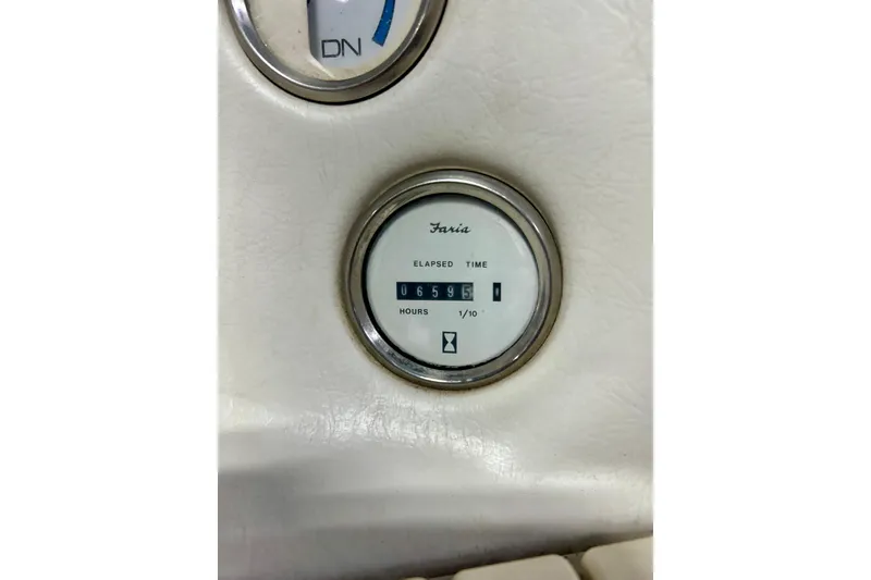 Slide: The Image of Hour meter on 1995 Crownline 202 BR boat dashboard, showing 695.1 hours. - 21