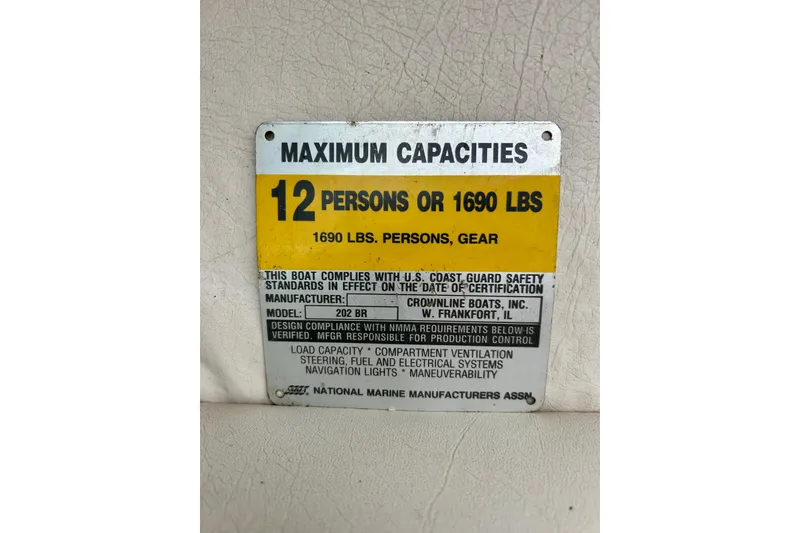 Slide: The Image of Capacity plate for 1995 Crownline 202 BR, max 12 persons or 1690 lbs. - 31