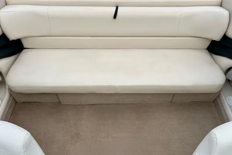 Slide: The Image of 1995 Crownline 202 BR boat interior with beige seating and carpet. - 37