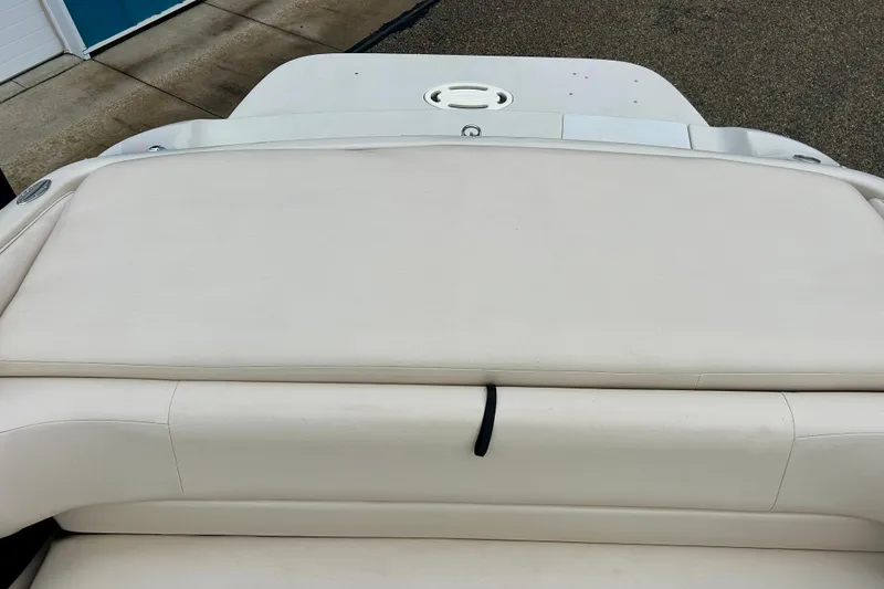 Slide: The Image of 1995 Crownline 202 BR boat with white cushioned seating and deck. - 39