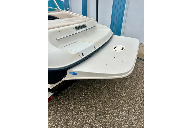 Slide: The Image of 1995 Crownline 202 BR boat stern view with swim platform. - 4