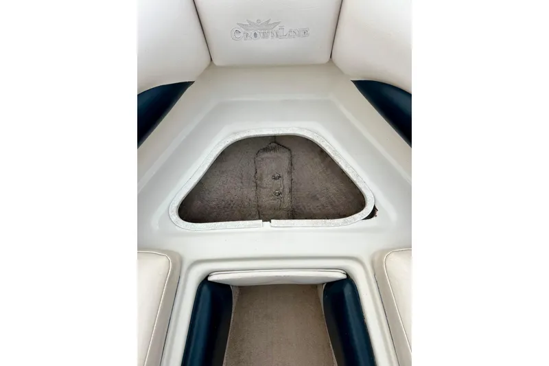 Slide: The Image of Interior view of a 1995 Crownline 202 BR boat, featuring seating and storage area. - 47