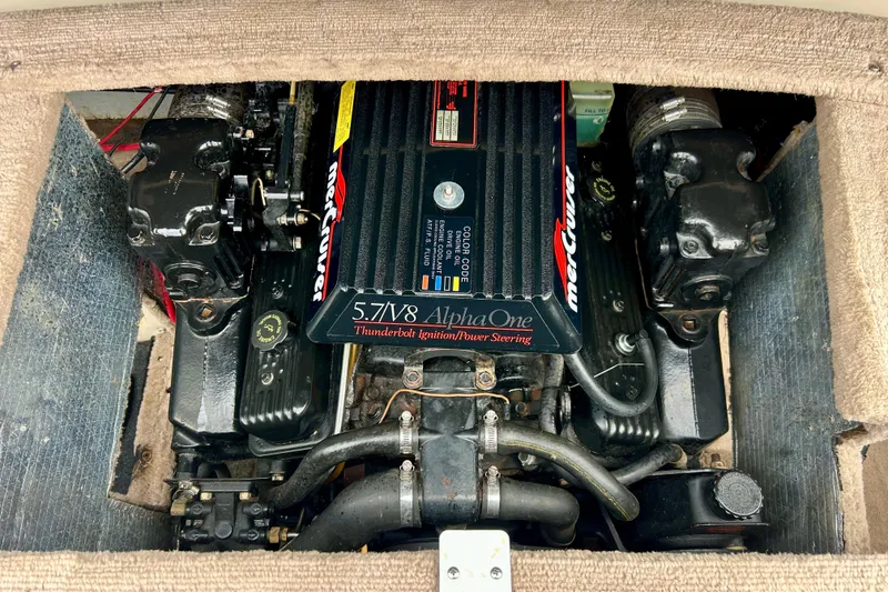 Slide: The Image of 1995 Crownline 202 BR boat engine, 5.7 V8 Alpha One, Thunderbolt ignition system. - 5