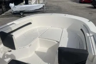 Slide: The Image of 2023 Trophy T24 CC boat interior with seating and storage compartments. - 10