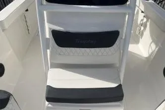 Slide: The Image of 2023 Trophy T24 CC boat interior with cushioned seating and sleek design. - 11