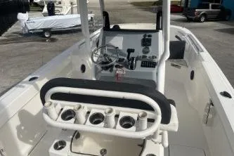 Slide: The Image of 2023 Trophy T24 CC boat interior with steering console and rod holders. - 8
