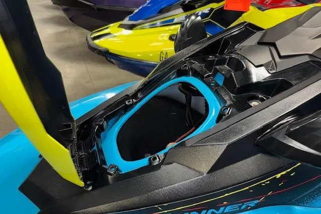 Slide: The Image of 2022 Yamaha WaveRunner JetBlaster with open storage compartment, showcasing vibrant blue and yellow design. - 16