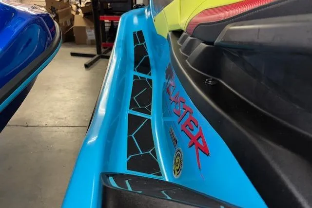 Slide: The Image of 2022 Yamaha WaveRunner JetBlaster in a garage, showcasing vibrant blue and yellow design. - 9