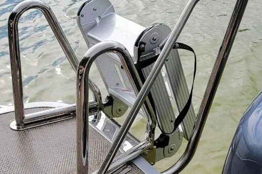Slide: The Image of Stainless steel boat ladder on Lowe SS 230 DV, 2026 model, near water. - 7