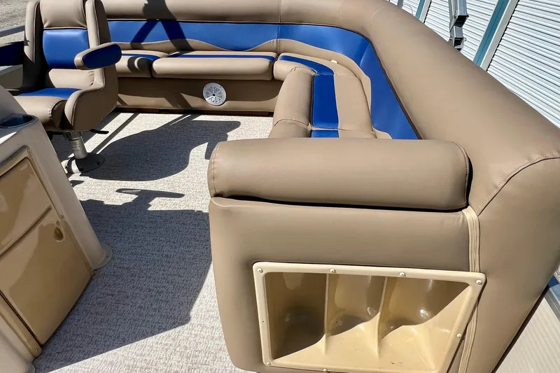 Slide: The Image of Interior of 2001 Premier 250 Grand Majestic boat with tan and blue seating. - 13