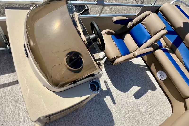 Slide: The Image of Interior of 2001 Premier 250 Grand Majestic boat with tan and blue seating. - 14