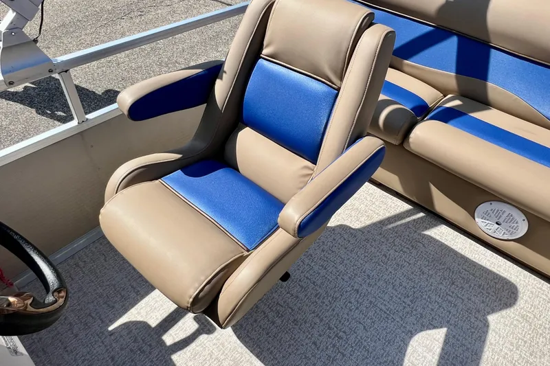 Slide: The Image of Luxurious seating on 2001 Premier 250 Grand Majestic boat, featuring blue and beige upholstery. - 15