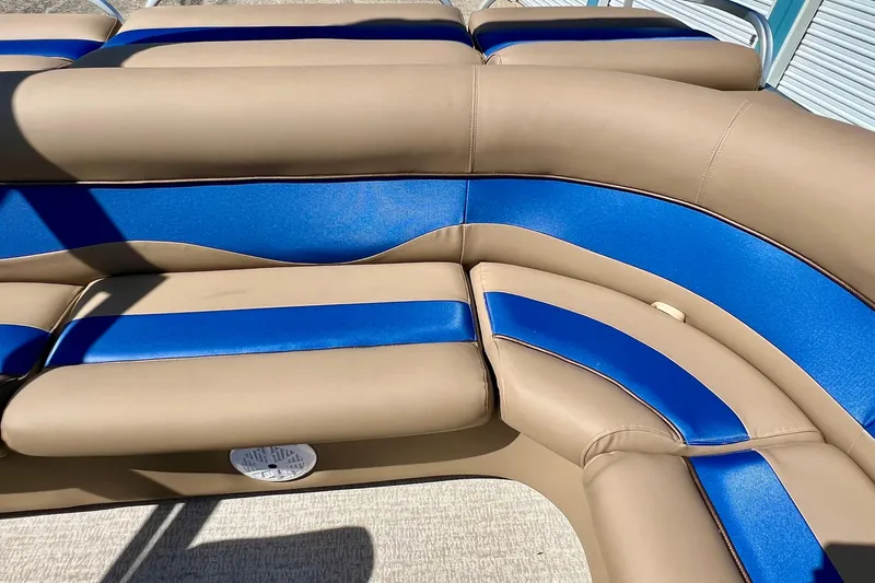 Slide: The Image of Tan and blue seating on a 2001 Premier 250 Grand Majestic boat. - 17