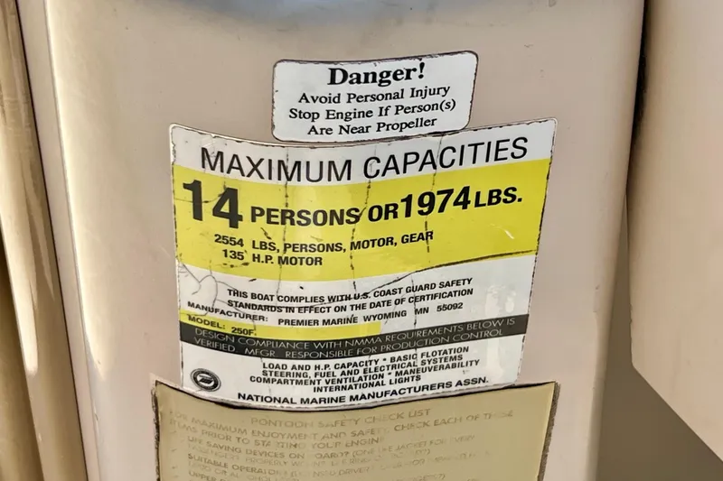 Slide: The Image of Warning label on 2001 Premier 250 Grand Majestic boat, maximum capacity 14 persons or 1974 lbs. - 20