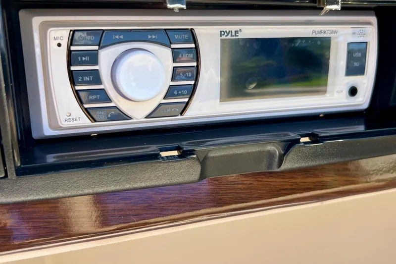 Slide: The Image of Pyle stereo system in 2001 Premier 250 Grand Majestic boat dashboard. - 21