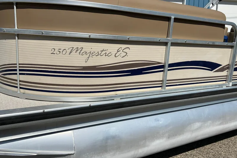 Slide: The Image of 2001 Premier 250 Grand Majestic pontoon boat with decorative side panel design. - 22