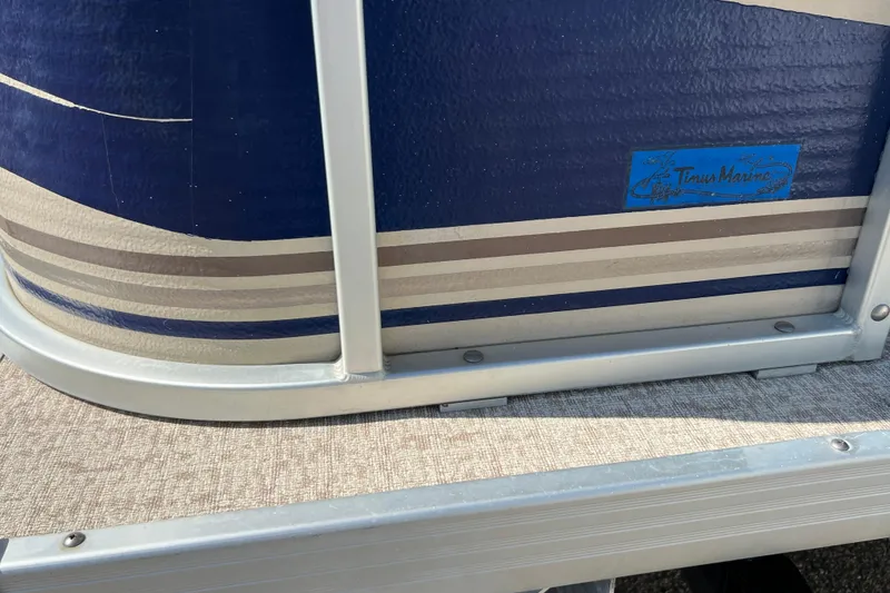 Slide: The Image of Close-up of 2001 Premier 250 Grand Majestic boat with blue and gray detailing. - 24