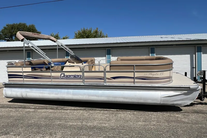 Slide: The Image of 2001 Premier 250 Grand Majestic pontoon boat parked outdoors. - 27