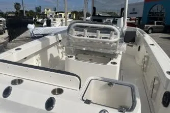 Slide: The Image of 2023 Trophy T24 CC boat interior with seating and storage compartments. - 7