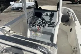 Slide: The Image of 2023 Trophy T24 CC boat interior with steering wheel and control panel. - 8