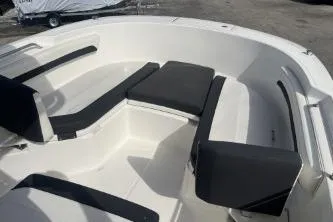 Slide: The Image of 2023 Trophy T24 CC boat interior with cushioned seating and sleek design. - 9