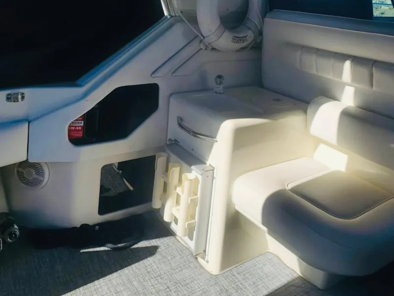 Slide: The Image of Interior of 1994 Sea Ray 400 Express Cruiser with seating and storage. - 6