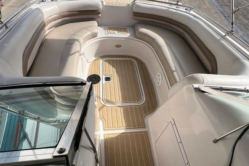 Slide: The Image of 2001 Hurricane SunDeck 237 OB boat interior with spacious seating and sleek design. - 11