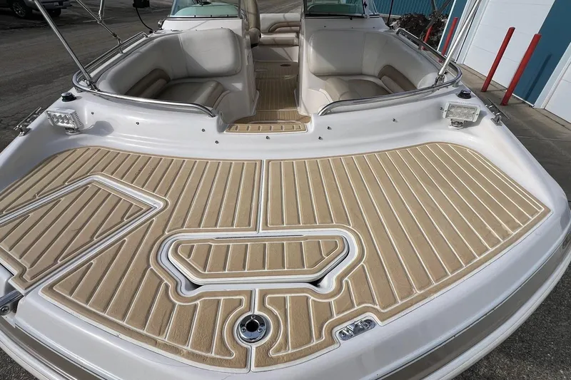 Slide: The Image of 2001 Hurricane SunDeck 237 OB boat with spacious seating and textured deck. - 2