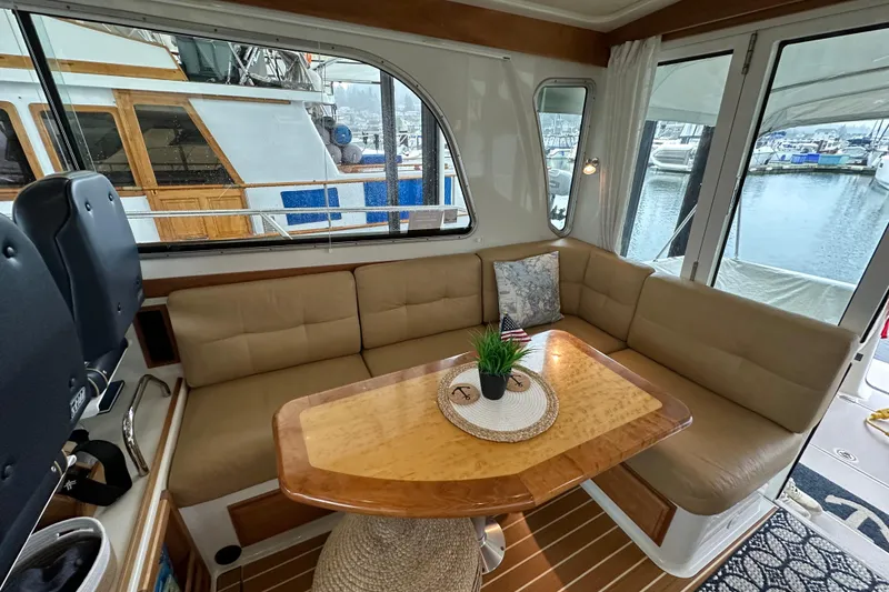 Slide: The Image of 2010 Back Cove 37 yacht cruising on open water, aerial view. - 17